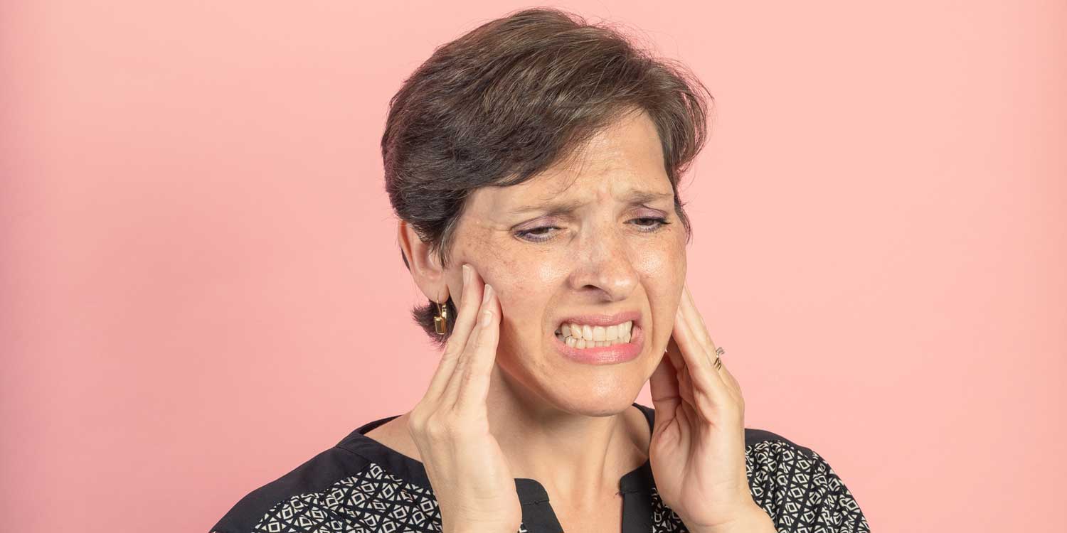 Woman is Touching Her Painful Mouth